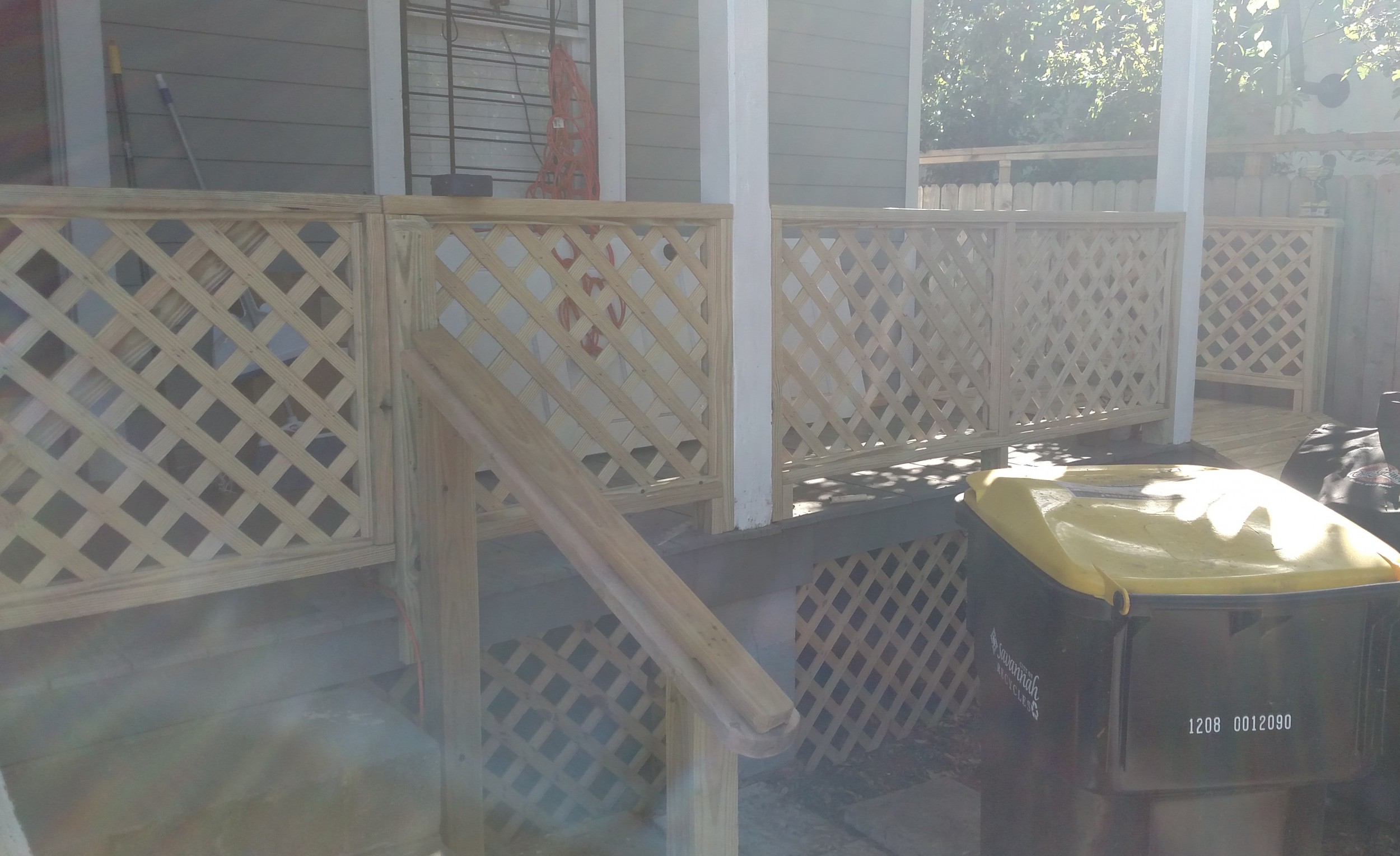 Added railing, gate, and banister to existing deck.
